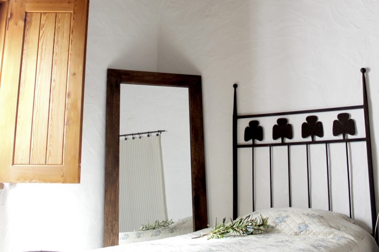 Comfortable bed with clean bathrobe in upscale hotel